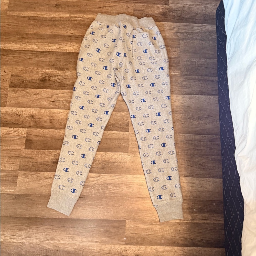 Champion Beige Joggers with Blue Logo Pattern